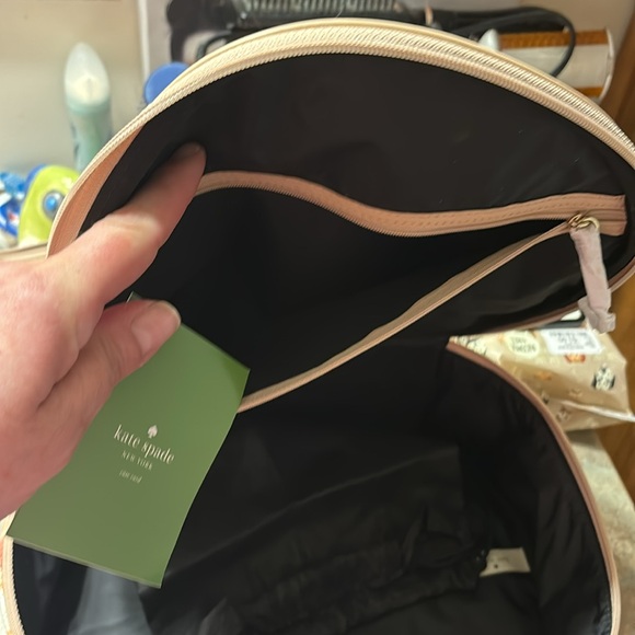 Kate Spade 11” clutch NWT. The only flaw is a small water mark under plastic. - Picture 5 of 16